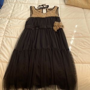 Black sleeveless dress by Rye